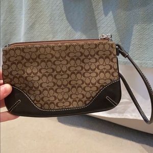 Brown and tan C coach wristlet